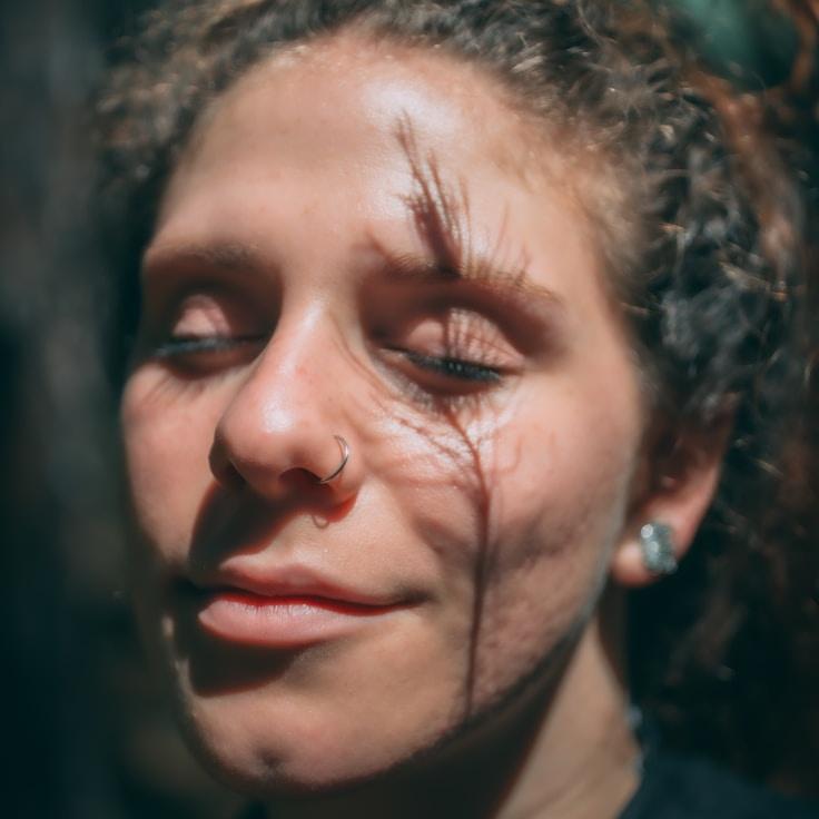 Alex Rivera, Lead Design Curator at TruePathArchive, reviewing corporate floral arrangements